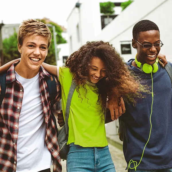 Cheerful teenage friends enjoying outdoors