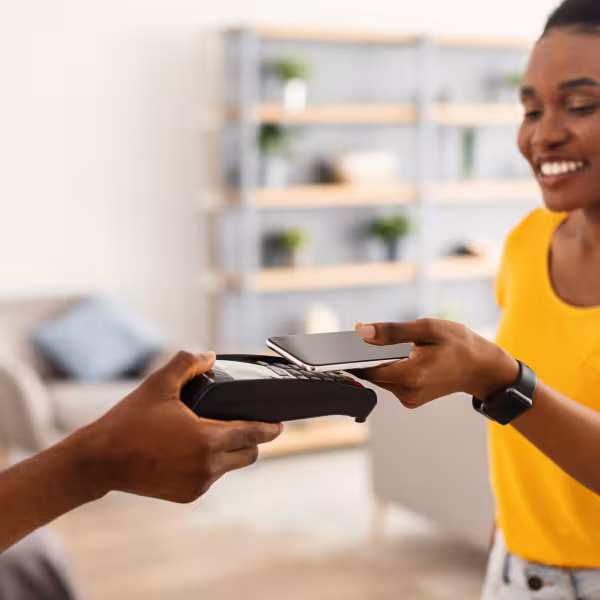 Woman making payment using digital banking features.