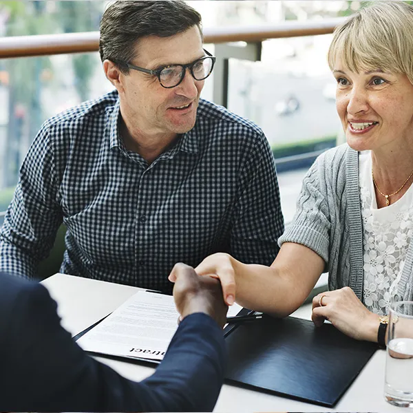Older couple at business meeting