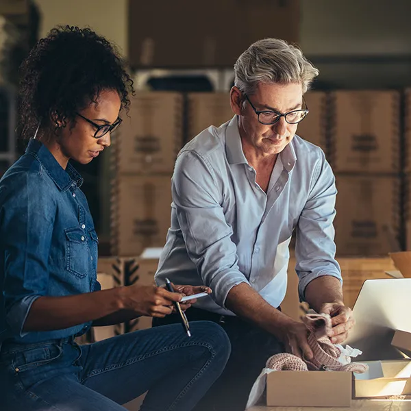 business owner teaching employee