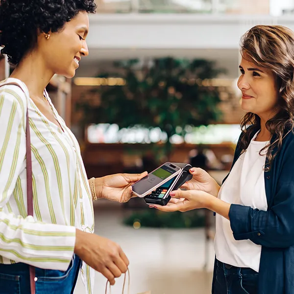 Woman paying with mobile wallet
