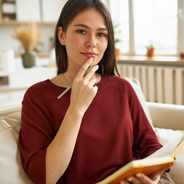 Woman writing in journal