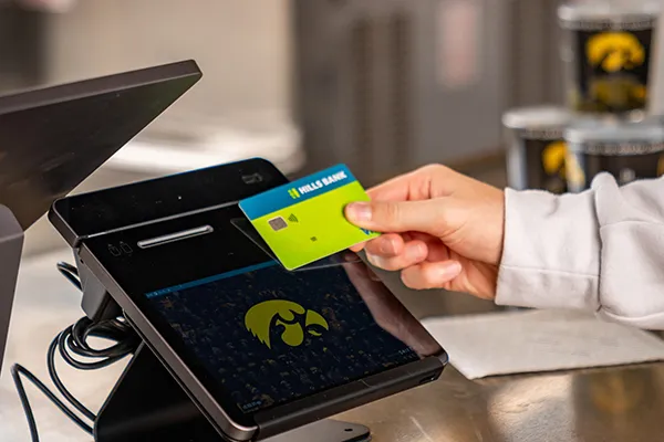 student using tap to pay
