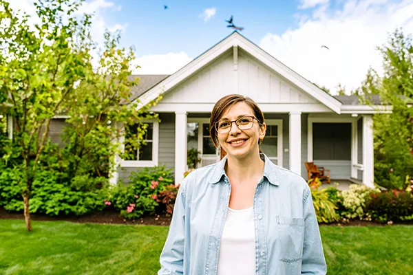 woman in front of home
