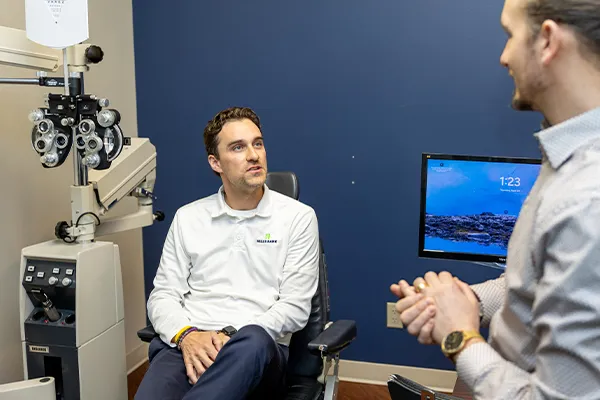 banker talking to optometrist