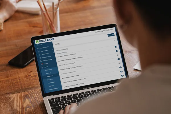 Person managing alerts in online banking
