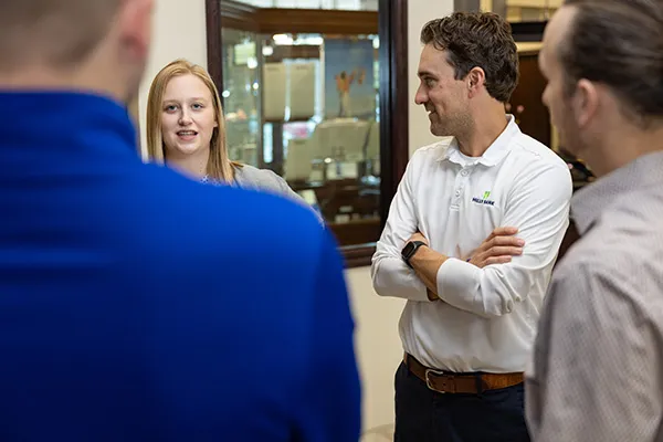 Bankers talking with business owners
