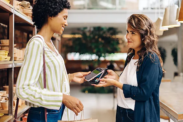 Woman paying with mobile wallet